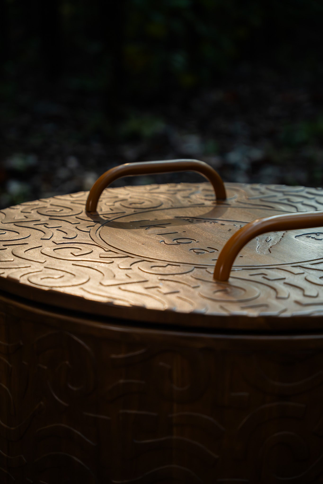 Engraved cold plunge tub by IKIGAI featuring handcrafted teak wood and signature brand detail